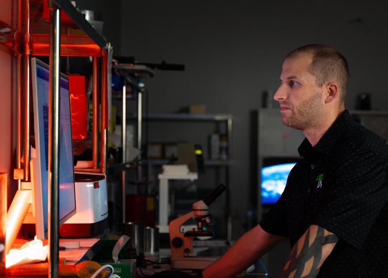 Allied UV employee working at a computer